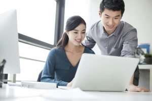 Young business person talking in office